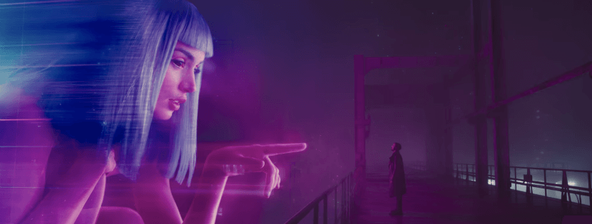 A huge holographic woman points at actor Ryan Gosling's character in the film Blade Runner 2049.